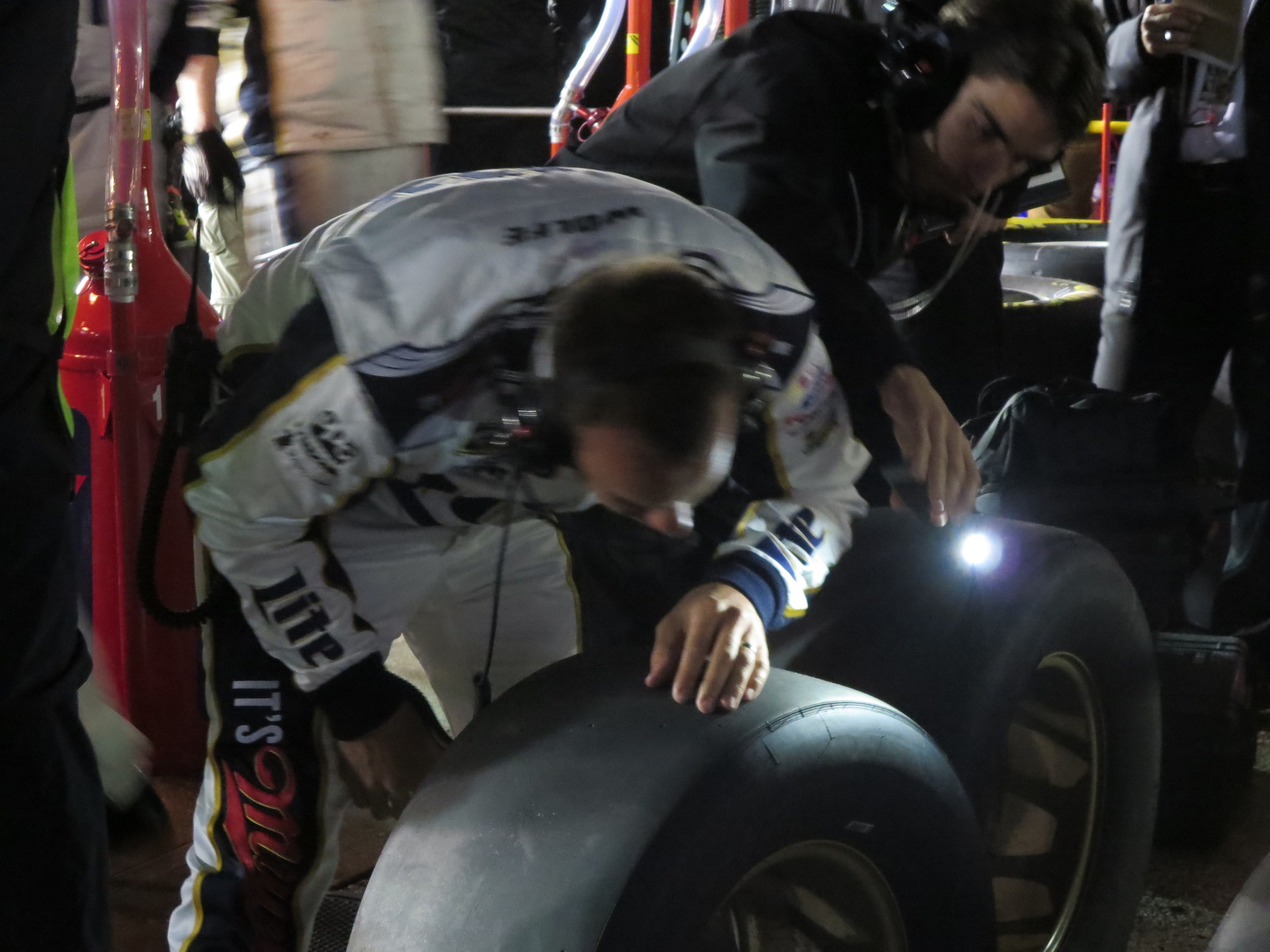 Paul Wolfe checking tire wear