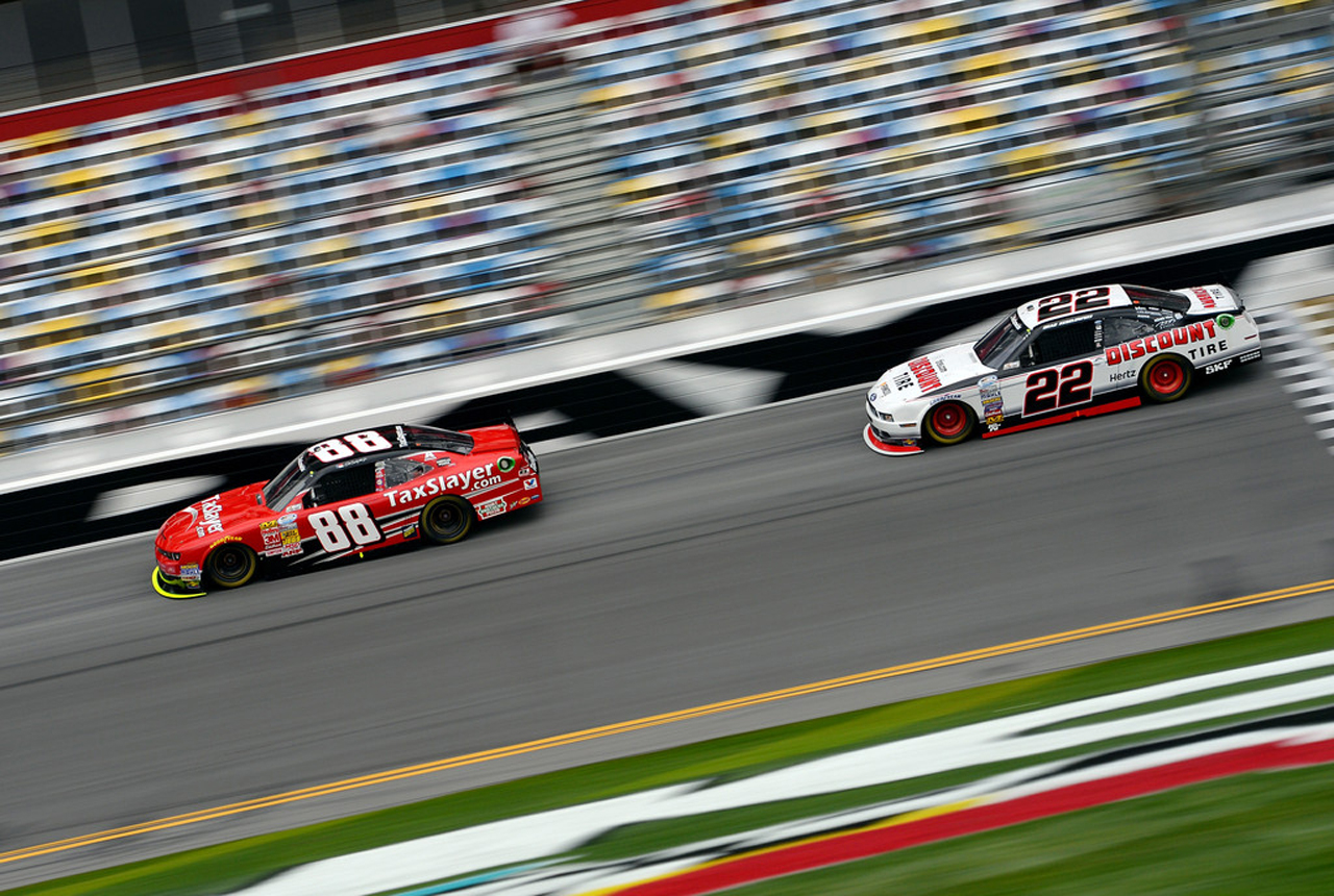 Kes rides behind Dale Earnhardt Jr. during Friday's qualifying session for the DRIVE4COPD 300 (Getty Images).