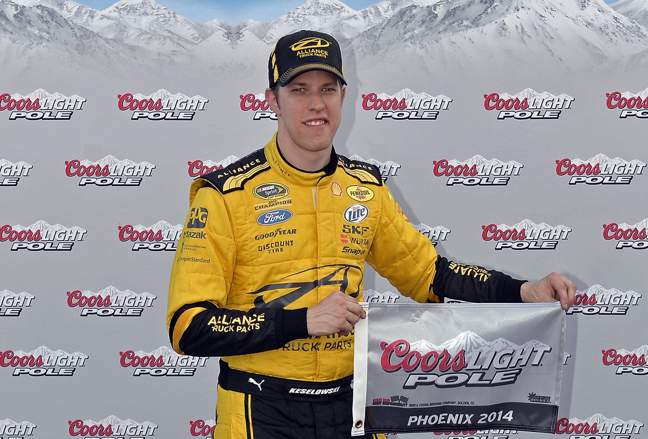 Brad poses with the flag after posting the best time and speed in NASCAR's first elimination qualifying session.